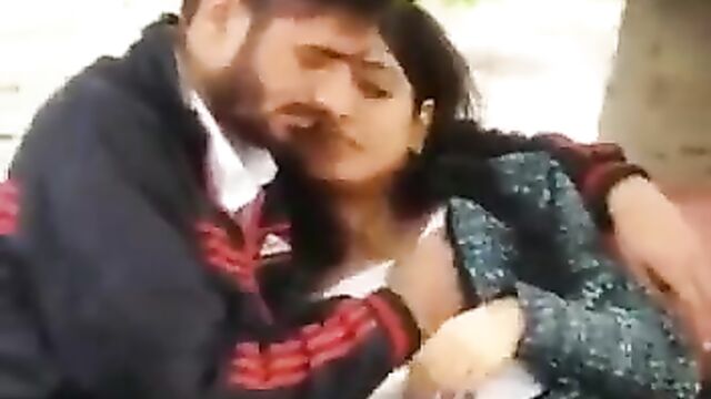 Indian University Student Caught Squeezing Girlfriend's Breasts And Receiving Blow Job In Public - 1 image