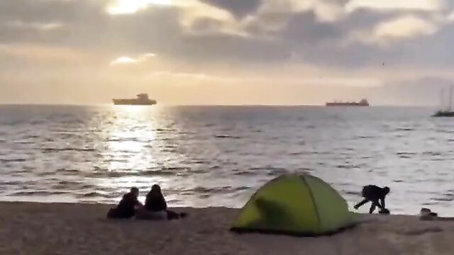 Randy Couple Caught Having Sex In A Tent On The Beach In Public