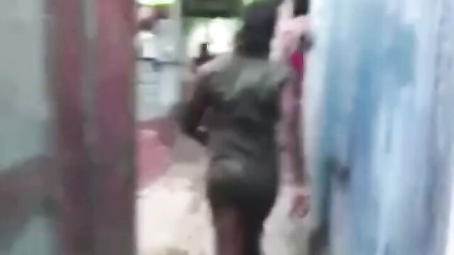 Pussy On Display In Public As Jamaican Girlfriend Beats Up Girl Without Panties For Allegedly Having Sex With Her Boyfriend - 1 image