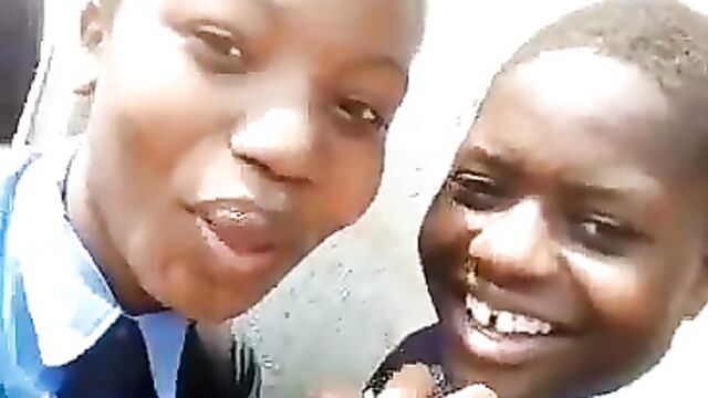 2 Naughty School Girls Caught Smoking In Public For Their Boyfriends After School In Zimbabwe