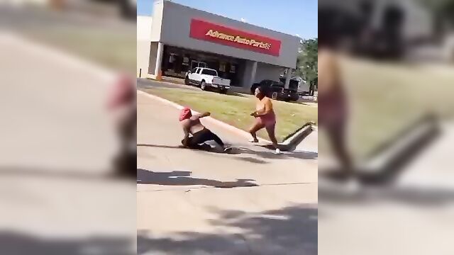 Breasts pop out in public as fat woman fights her rival on the street for allegedly snatching her boyfriend