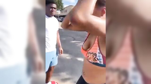 Breasts pop out in public as fat woman fights her rival on the street for allegedly snatching her boyfriend - 2 image