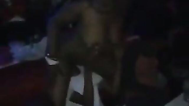 Nigerian Guy Sucking A Naked Stripper’s Pussy And Squeezing Her Big Breasts In A Nightclub In Public - 1 image