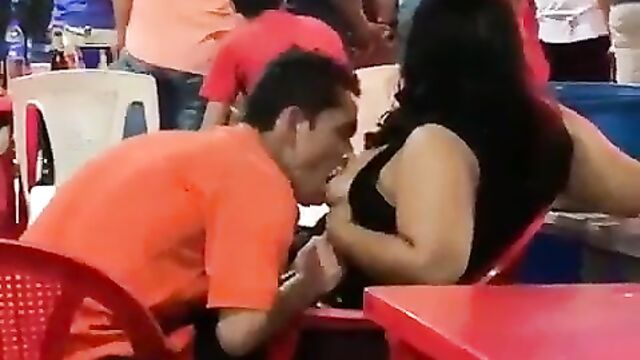 Guy Sucking Girlfriend’s Breasts In Public - 1 image