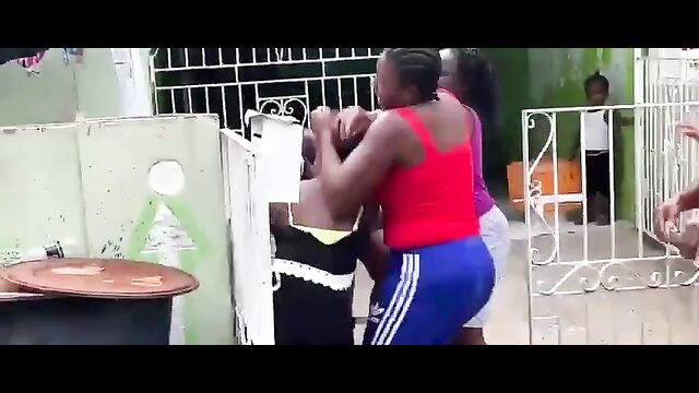 Breasts pop out as Jamaican girls fight in public