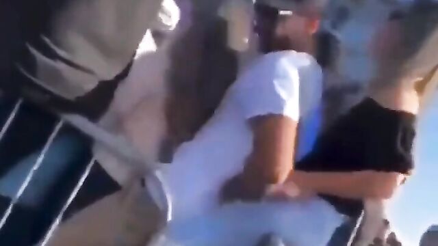 Man caught fingering side chick while with his wife in public - 3 image