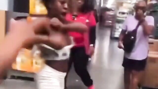 Boobs out as 2 girls fight in Walmart in public - 4 image