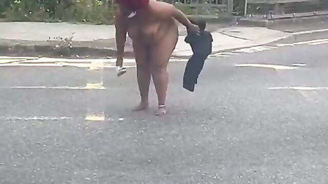 Naked ebony woman on a highway