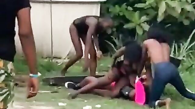 Pussy and boobs out in public as girl gets beaten for having sex with another girl’s boyfriend