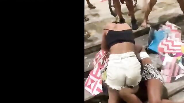 2 Brazilian women fighting in public, showing panties - 1 image