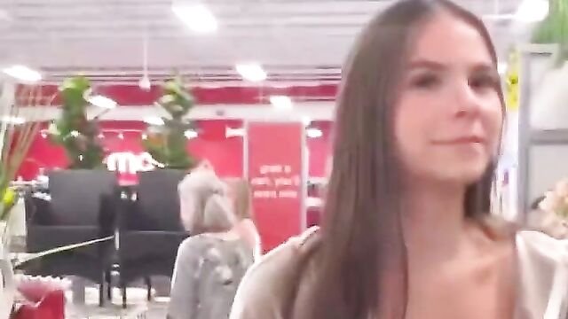 Girl showing off her big breasts in a store in public - 3 image