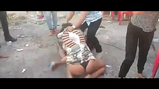 2 ladies fighting naked in public, showing breasts - 4 image