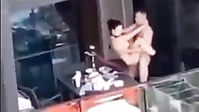 Crazy couple caught having sex on the balcony in public - 3 image
