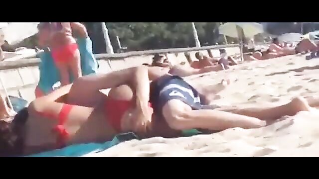 Couple having discreet sex on the beach in public - 5 image