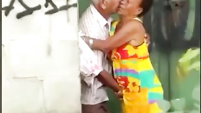 Horny old man fingering old woman in public