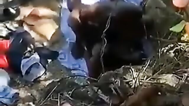 Naked ebony couple caught having sex in the bush in public without giving a damn - 3 image