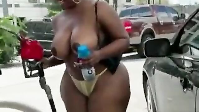 Ass and Boobs out in public as big ass chick pumps gas at the station