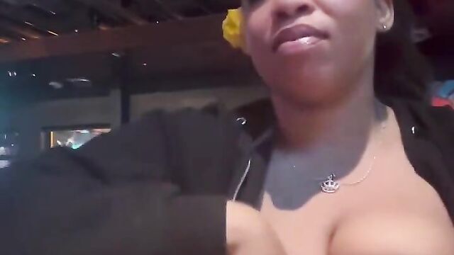 Girl caught showing her breasts in a public bar - 1 image