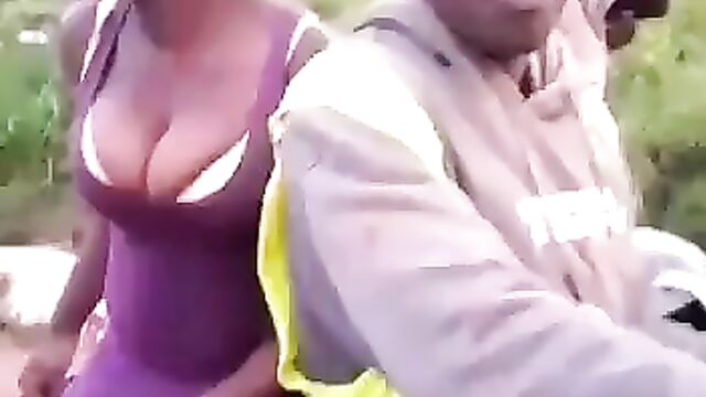 African queen tries to cover her naked coochie on a bike