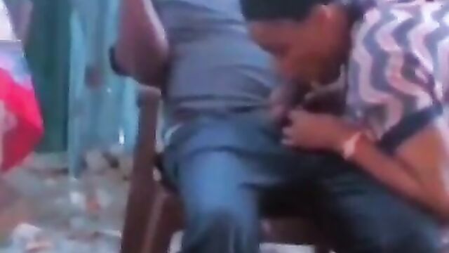 African girl giving sugar daddy blow job in public in a restaurant