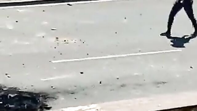 Naked woman confronts riot police in South Africa - 1 image