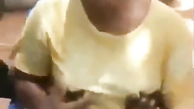 2 guys playing with Ashawo’s breasts and nipples in public