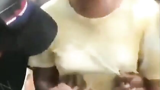 2 guys playing with Ashawo’s breasts and nipples in public - 5 image