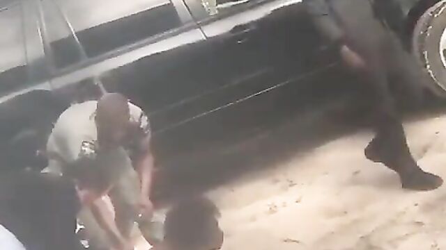 Breasts pop out as Nigerian police allegedly strip woman naked in public