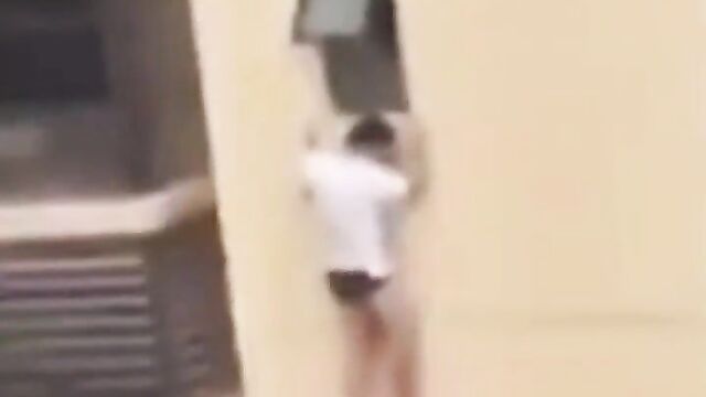 Side guy hides outside apartment window of high rise building, after his married girlfriend’s husband returned home too early!