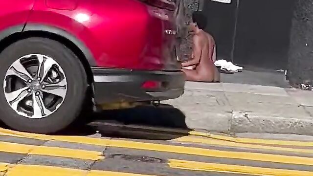 Naked couple caught discussing in public - 1 image