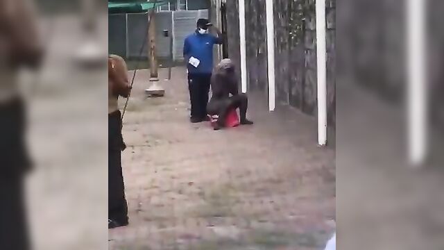 Naked mad woman walking away from agents - 4 image