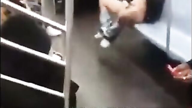 Woman touching herself on a train in New York City - 1 image