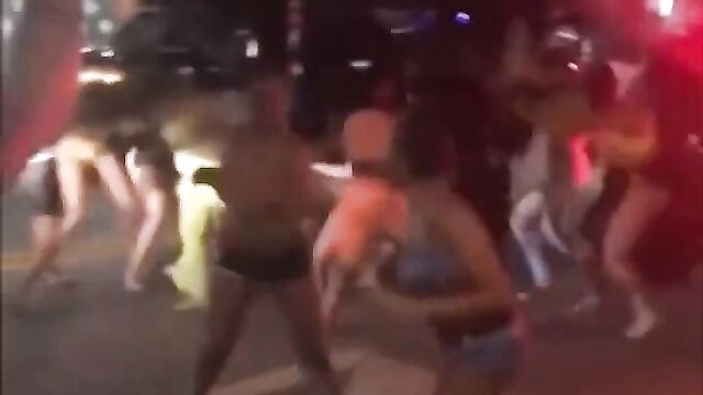 Breasts pop out as prostitutes get caught fighting in public - 1 image