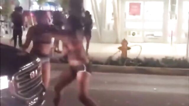Breasts pop out as prostitutes get caught fighting in public