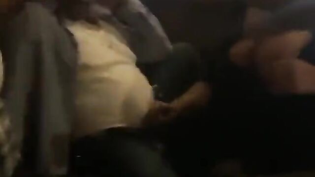 Lady giving her sugar daddy a hand job in public - 1 image