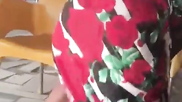 African woman strips, showing her big nyash in a public restaurant - 1 image