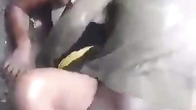 Crazy dude having sex on the ground in public - 1 image