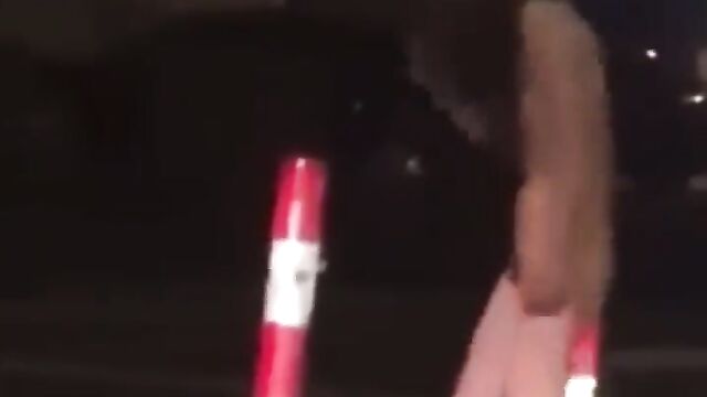 Naked woman masturbating on the road, obstructing traffic - 1 image