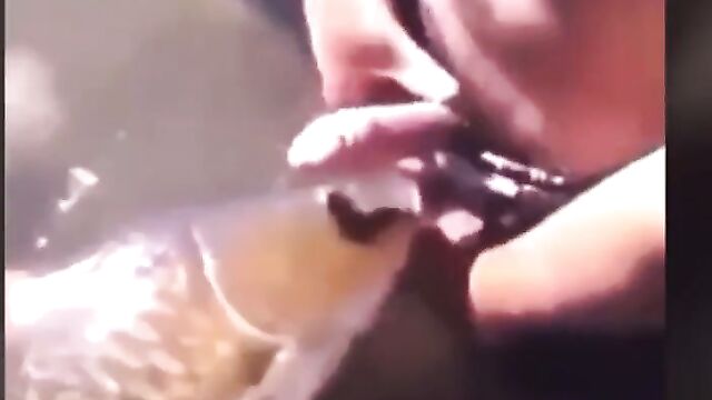 Man having sex with a fish - 1 image