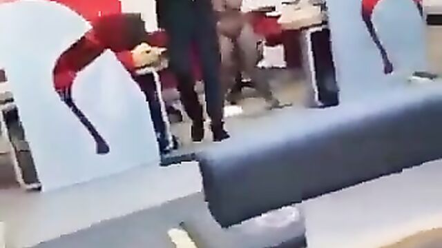 Woman strips naked in a bank