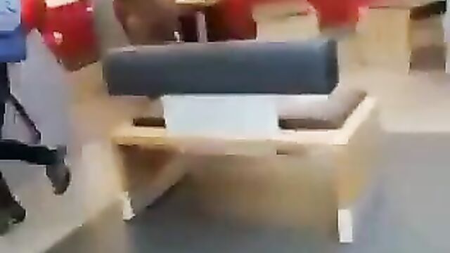 Woman strips naked in a bank - 3 image