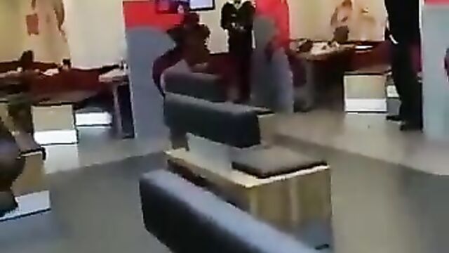Woman strips naked in a bank - 5 image