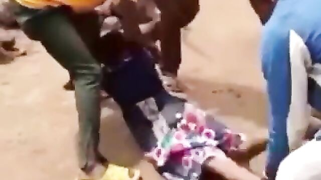 Ass pops out as crazy fashion police beat African woman in public for allegedly not wearing panties and wearing a ‘short’ dress to the market - 1 image