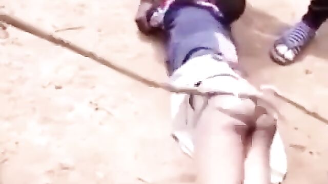 Ass pops out as crazy fashion police beat African woman in public for allegedly not wearing panties and wearing a ‘short’ dress to the market - 5 image