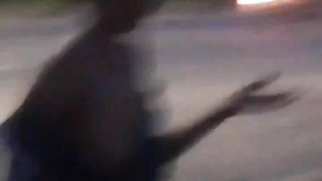 Nigerian lady showing her breasts after stripping and running mad in public