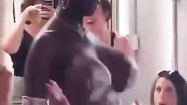 Stripper exposing her big breasts in public at a party for money