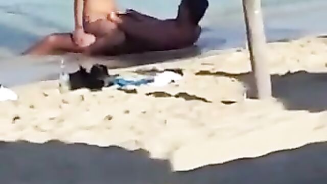 Couple having sex on the beach - 1 image