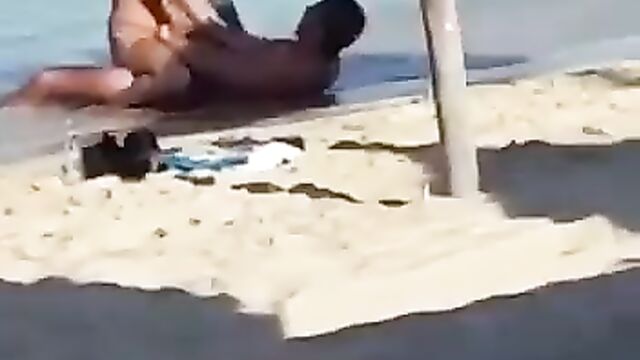 Couple having sex on the beach