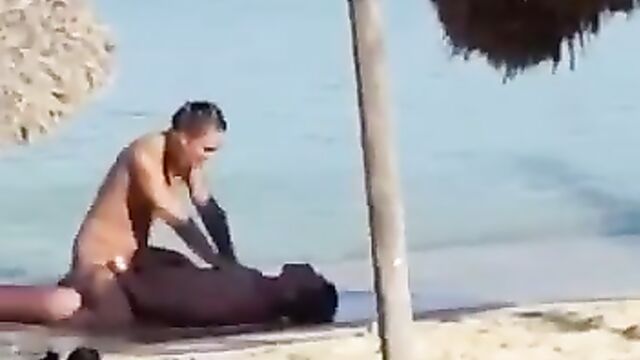Couple having sex on the beach - 4 image