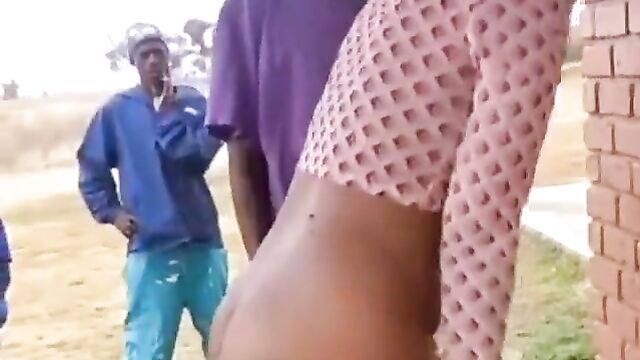 Mzansi man banging a thot doggy style in front of his friends on a public field - 1 image